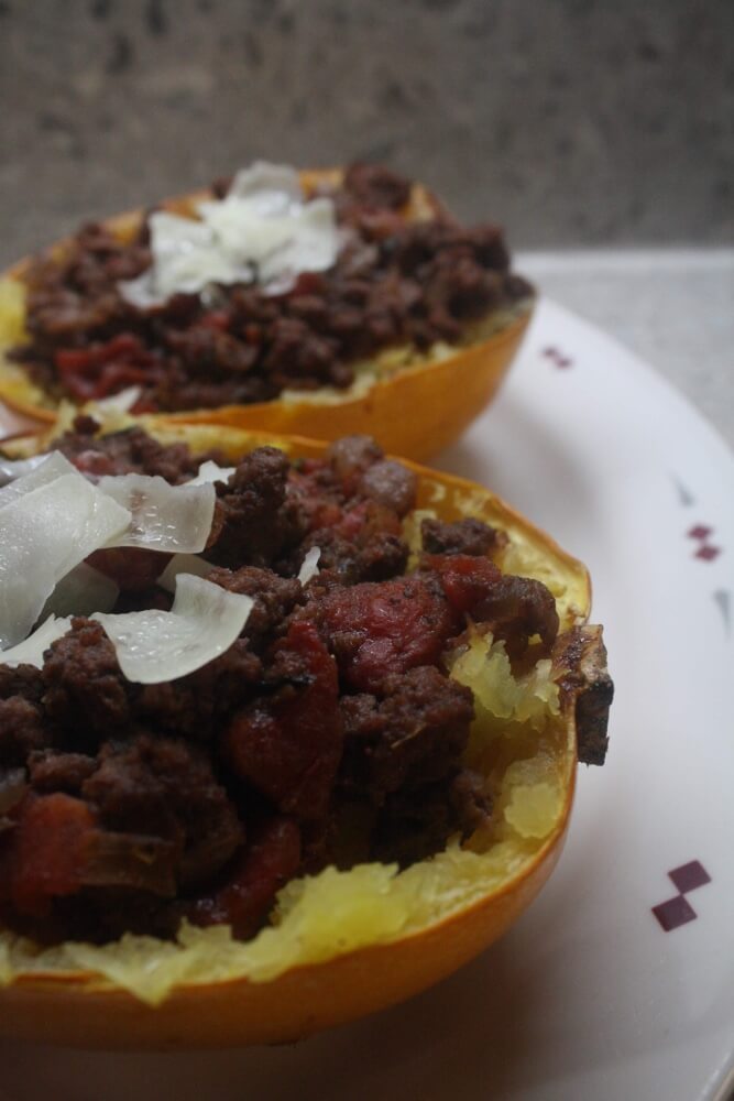 spaghetti squash boats with cheese on platter