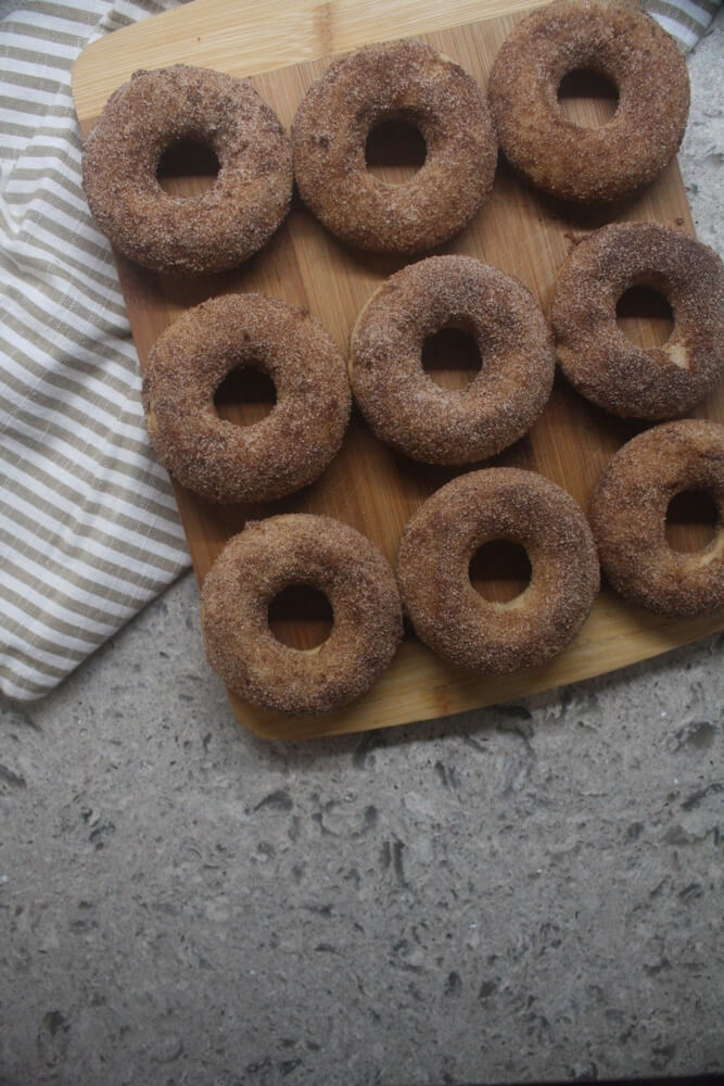 aerial view of three rows of  doughnuts