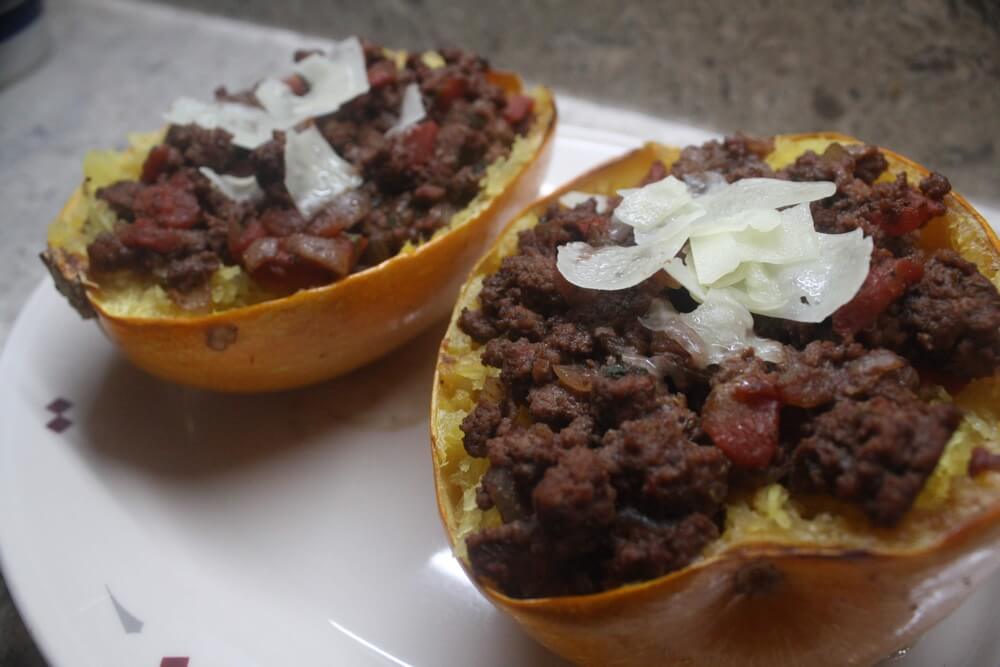 two spaghetti squash on platter